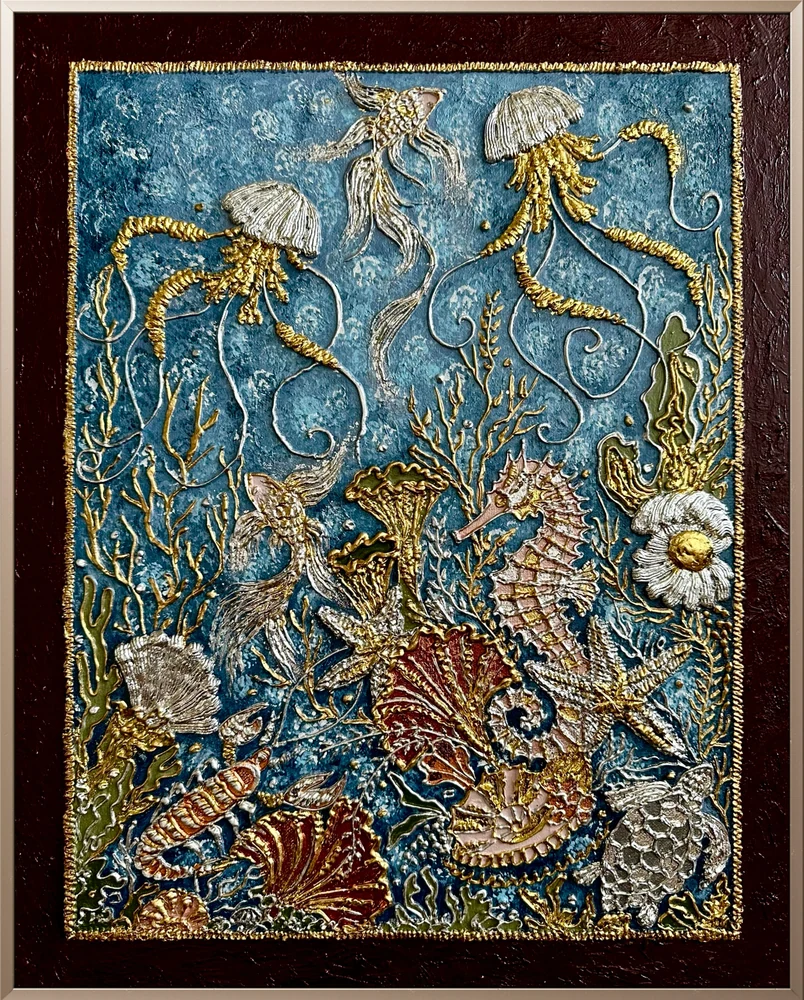 Seahorses, jellyfish and sea creatures among gold and silver relief against a blue underwater background