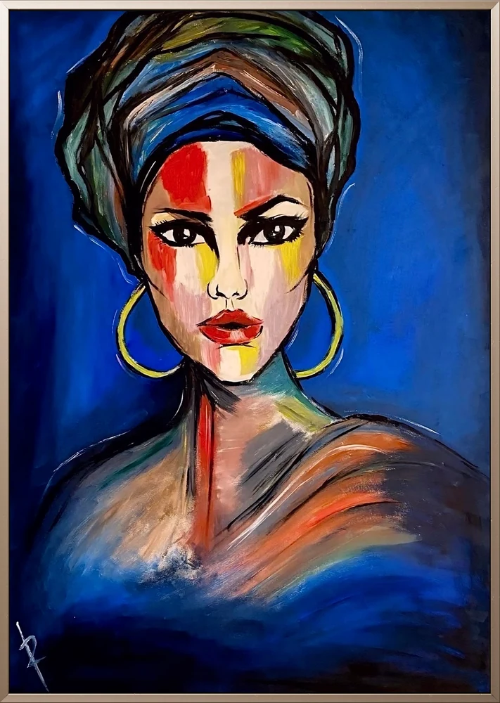 Woman with a colorful headwrap and gold hoop earrings against a blue background